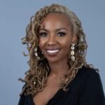 smiling-woman-with-dreadlocks-and-earrings
