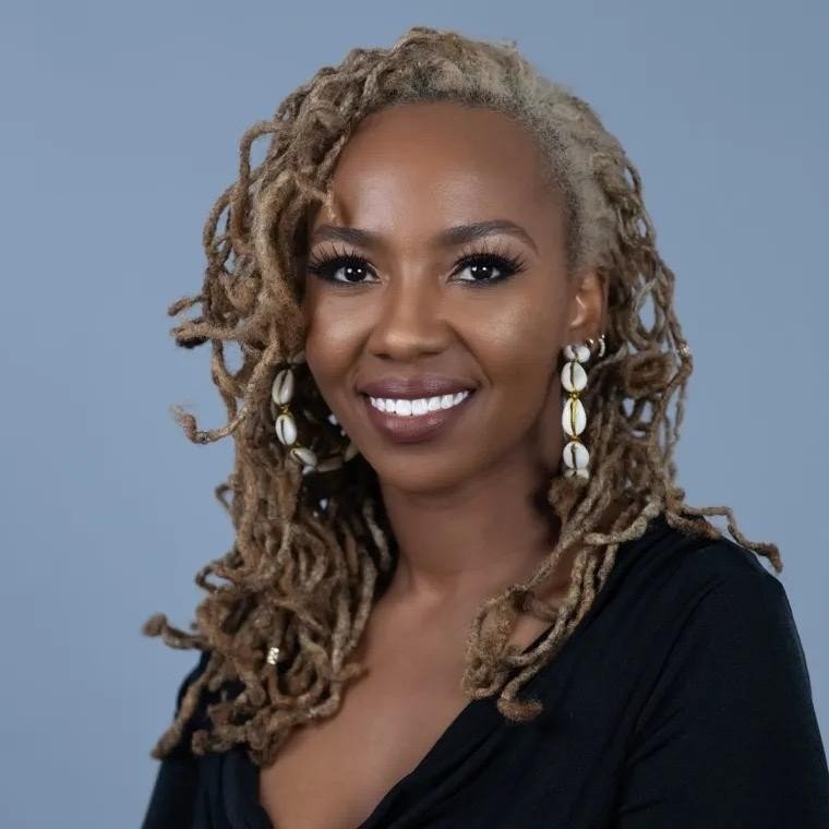 smiling-woman-with-dreadlocks-and-earrings