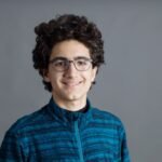 smiling-young-man-blue-shirt