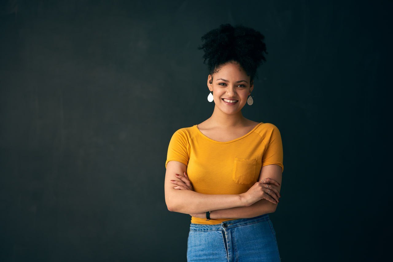 smiling-woman-yellow-shirt
